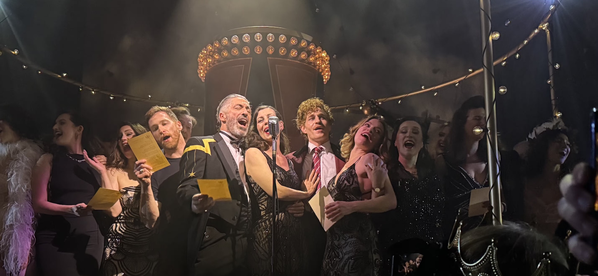 The final company of Sleep No More, gathered to sing at the McKittrick Hotel